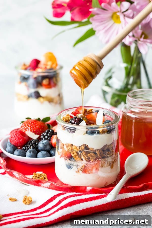 Craft Your Own Brunch Parfait Bar 2 A beautifully arranged DIY yogurt parfait bar featuring colorful fruits, various yogurts, and granolas in elegant serving bowls for a spring brunch.