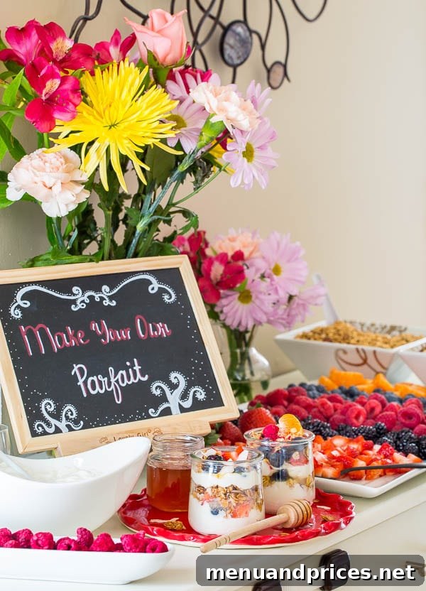 Craft Your Own Brunch Parfait Bar 4 Elegant brunch table with a DIY yogurt parfait bar, showcasing various ingredients in clear glass bowls and mason jars, perfect for a gathering.
