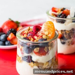 Craft Your Own Brunch Parfait Bar 10 A vibrant individual yogurt parfait with layers of fruit and granola.