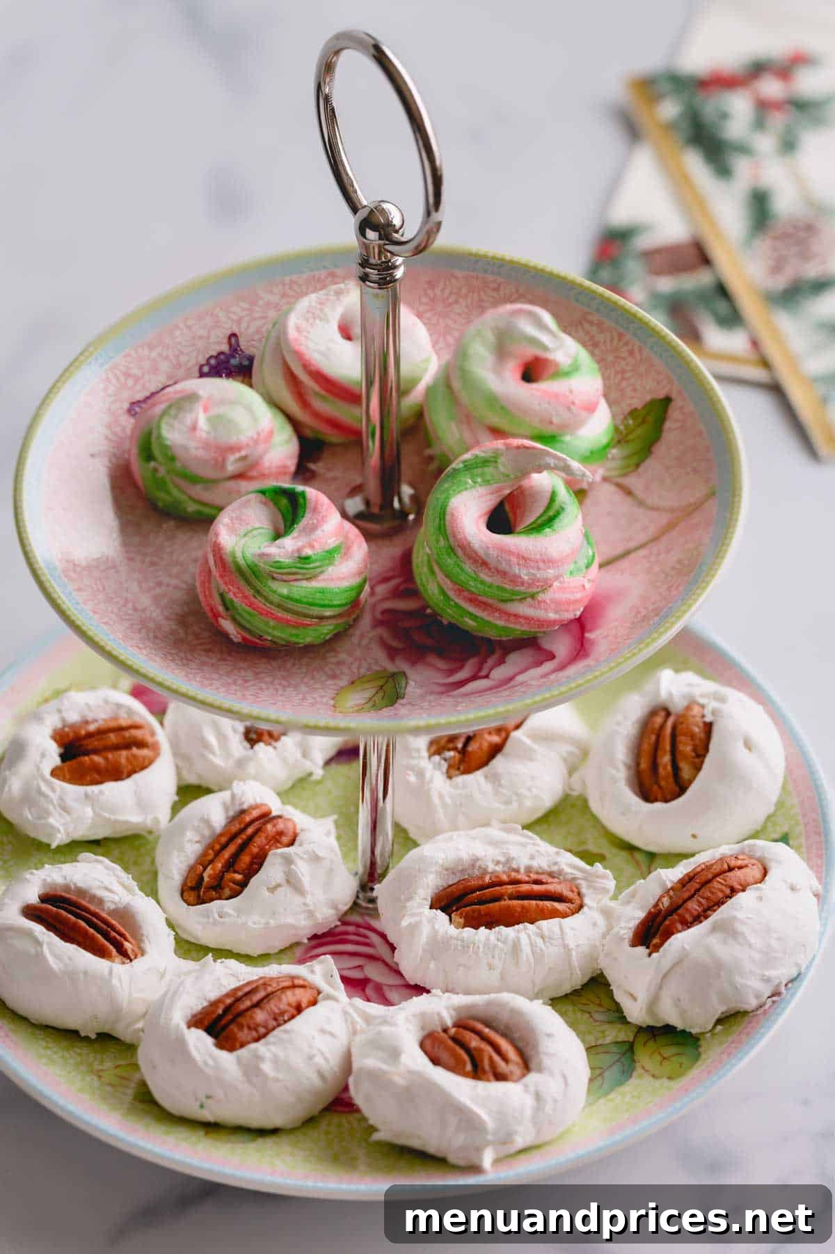Grandma's Divinity Sweet 3 A two-tiered serving platter displaying a delightful array of divinity candies, with classic pecan divinity on the bottom and vibrantly colored red and green divinity on the top layer, ready for festive serving.