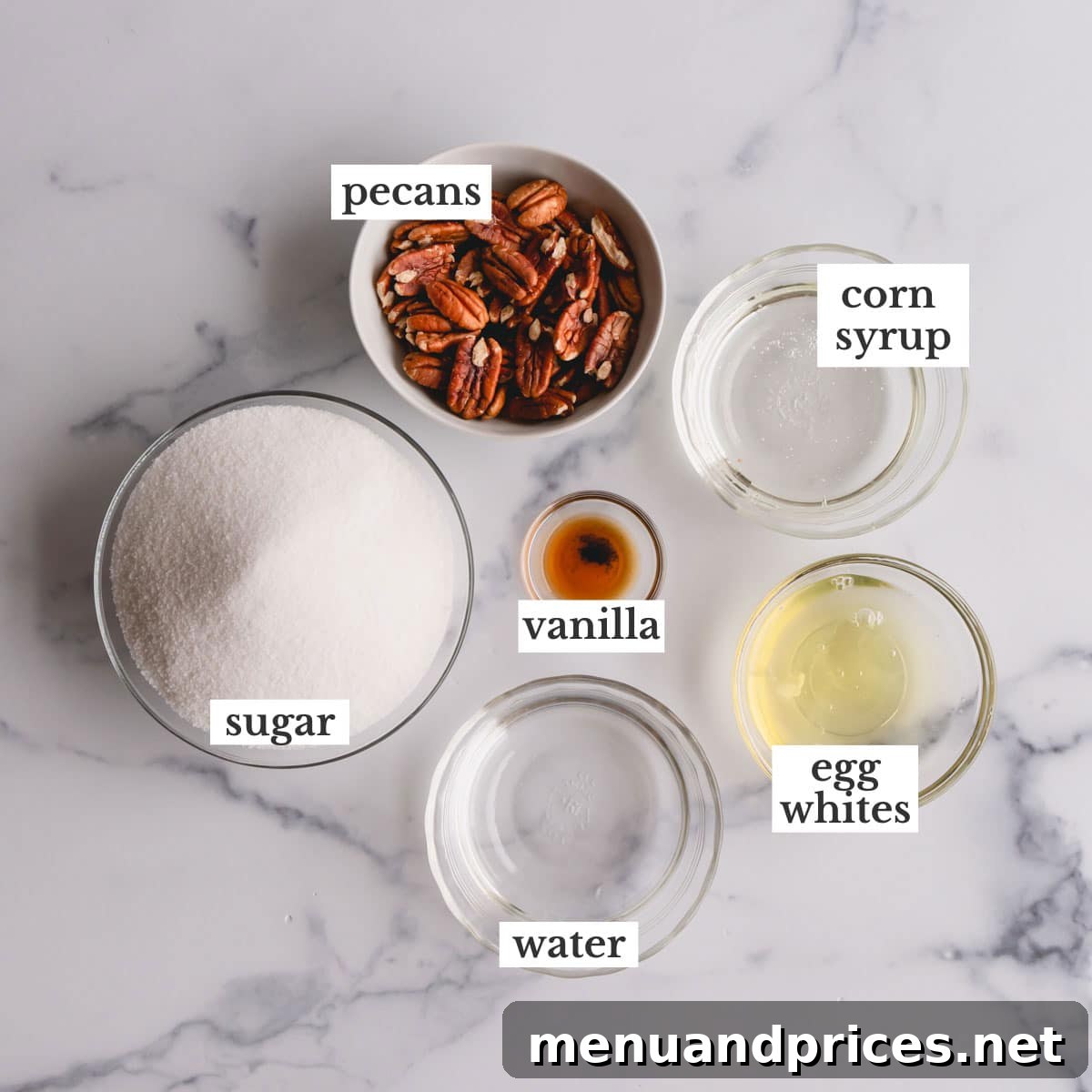 Grandma's Divinity Sweet 4 A collection of essential ingredients for making divinity candy, including granulated sugar, corn syrup, egg whites, vanilla extract, and pecan halves, neatly arranged on a white surface.