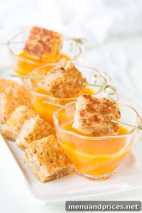 Velvety 5-Ingredient Butternut Squash Soup 5 A top-down view of the beautifully plated butternut squash soup, garnished with fresh herbs and a swirl of cream, ready to be enjoyed as an elegant make-ahead dish.