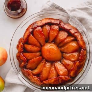 Overhead image of a pear tarte tatin, highlighting its texture and appeal.