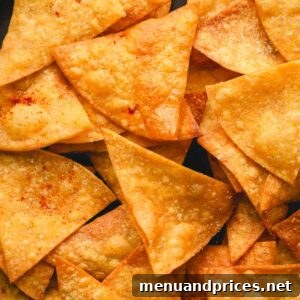Homemade spicy tortilla chips on a plate, ready to be eaten.