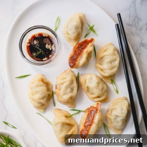 Delicious Beef Dumplings on a plate with dipping sauce