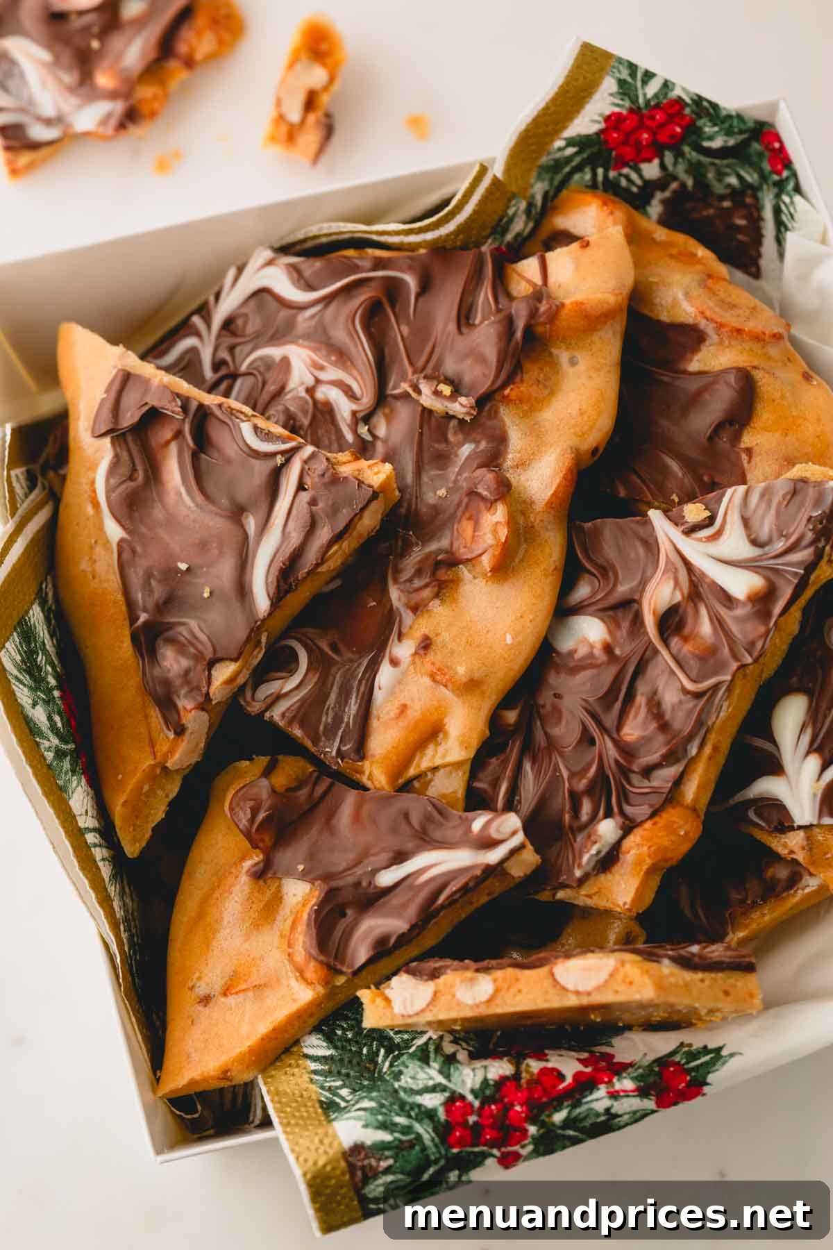Gourmet Chocolate Peanut Brittle 12 A charming box filled with individual pieces of chocolate peanut brittle, making a perfect homemade gift.