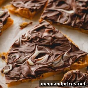 Pieces of chocolate peanut brittle, showing the varied shapes and sizes after breaking.