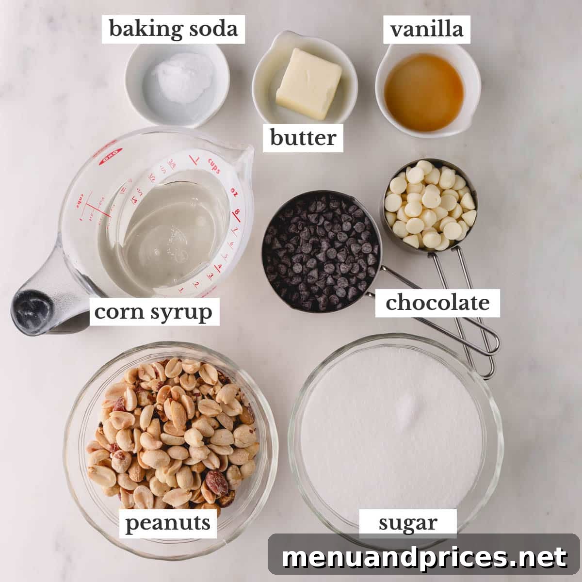 Gourmet Chocolate Peanut Brittle 5 All the essential ingredients neatly laid out to make chocolate peanut brittle, including peanuts, sugar, corn syrup, butter, vanilla, baking soda, and chocolate chips.