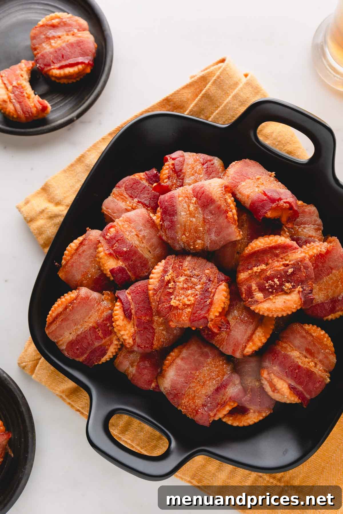 Bacon Cheddar Crisps 2 A generous bowl brimming with golden-brown cheesy bacon crackers, perfectly baked and ready for snacking.