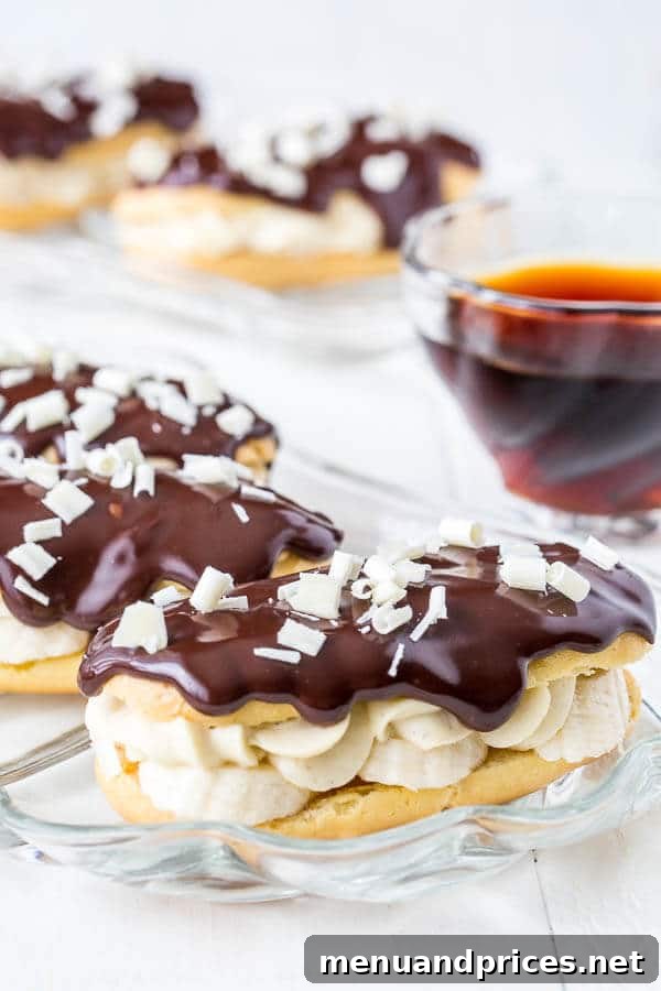 Banana Cream Pie Eclairs - a delightful pastry with vanilla pudding, fresh bananas, and chocolate ganache.