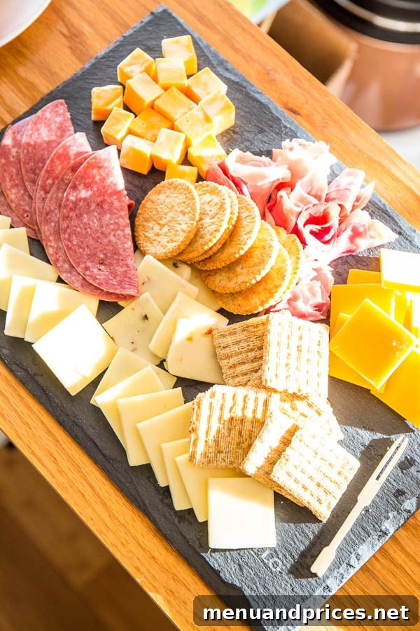 Celebrating Grant's First Trip Around the Sun 5 A mini cheese board with crackers, grapes, and cheese