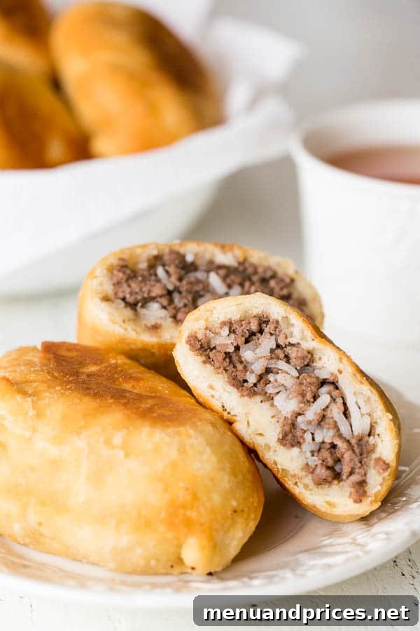 Hearty Russian Meat Piroshki 5 Perfect for picnics, potlucks, and any summer activity, these Russian piroshki (meat hand pies) feature tender, soft dough, a simple meat and rice mixture, and are fried to crisp golden perfection.