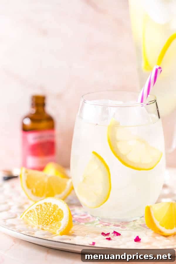 Rose-Kissed Lemonade 5 Four glasses of rose lemonade on a rustic wooden tray, garnished with lemon and rose petals, ready to be enjoyed outdoors.