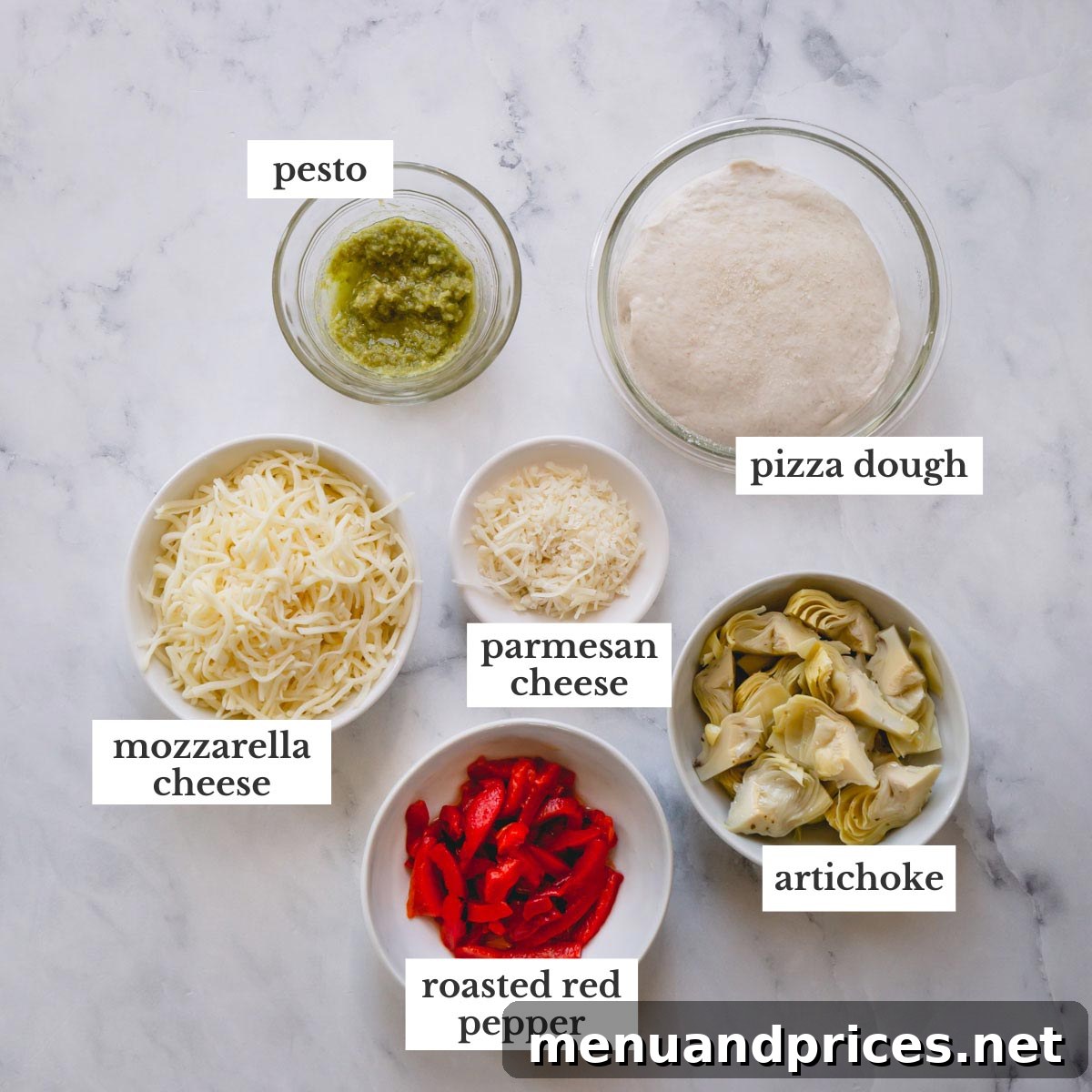 Enginarlı Izgara Pizza Sırları 4 A flat lay arrangement of all the fresh and vibrant ingredients required for making the grilled artichoke pizza, ready for assembly.