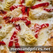 A whole grilled artichoke pizza.