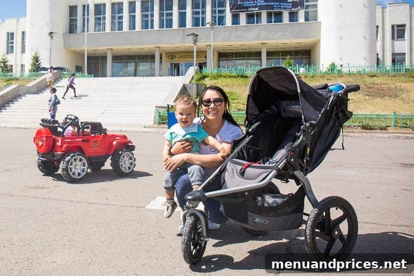 Grant's Inaugural Mongolian Expedition Part One 6 Baby Grant looking around in a scenic part of Erdenet city, with trees and buildings