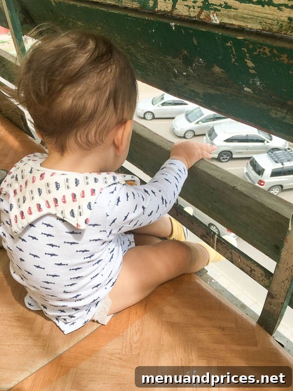 Grant's Inaugural Mongolian Expedition Part One 8 Baby Grant safely sitting on a balcony in Erdenet, observing street life below
