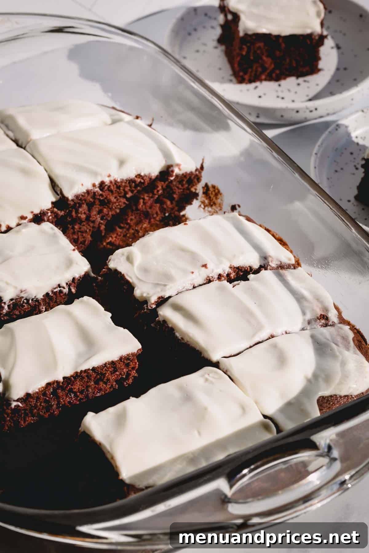 Effortless Chocolate Cherry Bliss 6 A beautifully frosted chocolate cherry cake adorned with a delicate layer of soft cream cheese frosting, inviting a delightful taste.