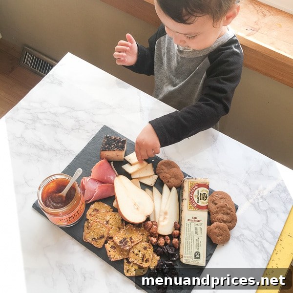 Culinary Chaos with a Curious Kid 6 Close-up of a toddler boy Grant's small hand reaching for a piece of food on a rustic kitchen counter, curiosity in action