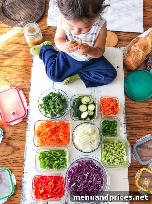Culinary Chaos with a Curious Kid 9 Toddler boy Grant happily munching on raw vegetables while actively helping his mom prepare them for a photoshoot for the Busy Cooks website