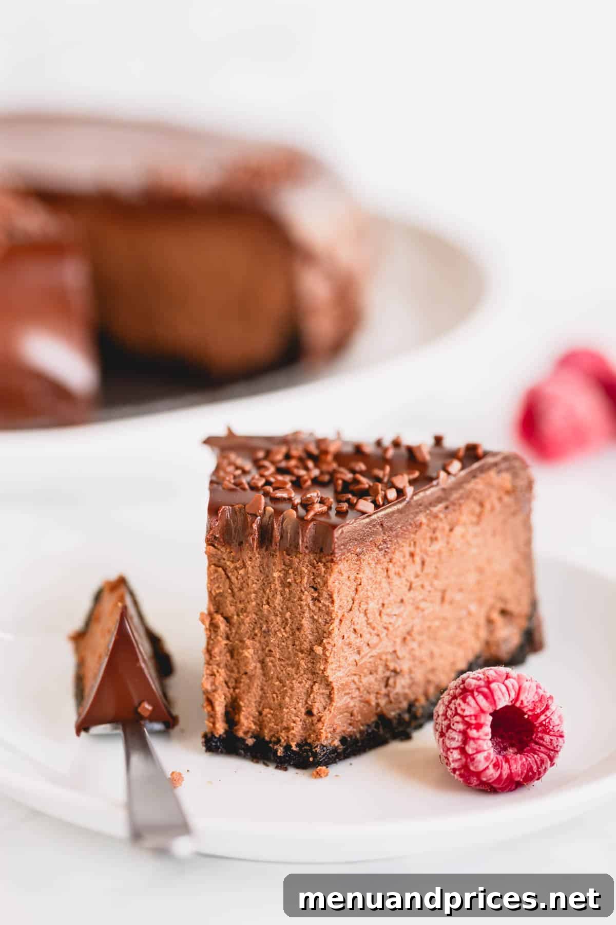 Velvet Chocolate Heaven Cheesecake 3 A close-up of a slice of supreme chocolate cheesecake with a fork taking a bite, showing the creamy filling and ganache.