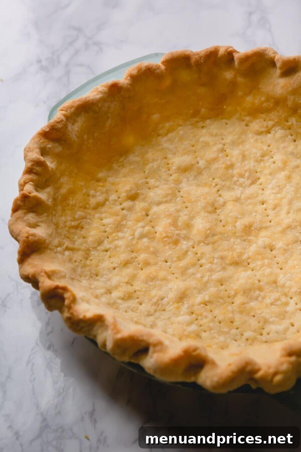 Heavenly Pecan Pie Perfection 4 Pie crust being blind-baked with pie weights
