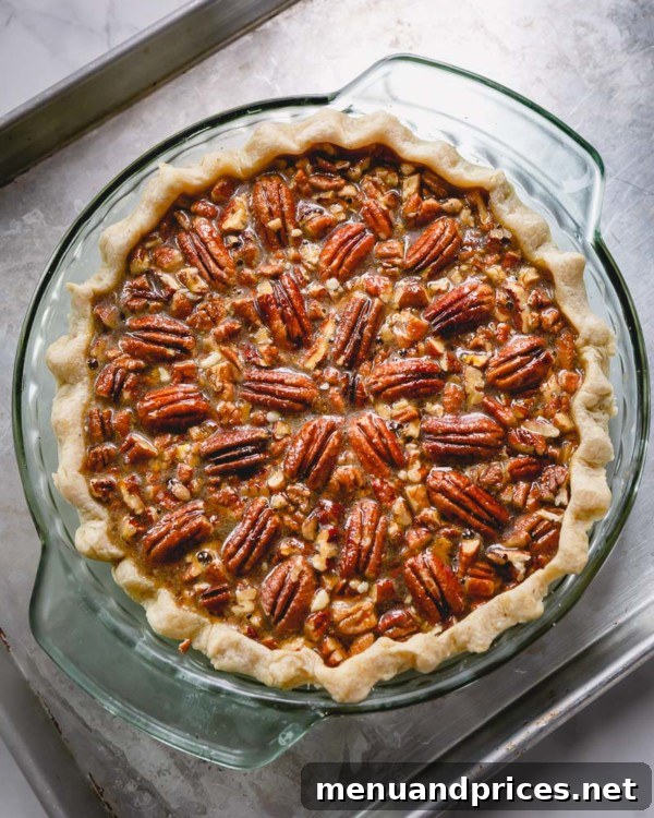 Heavenly Pecan Pie Perfection 7 Pecan pie baking in the oven on a baking sheet