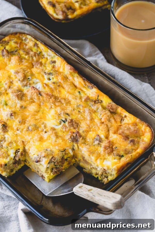 Post-Feast Stuffing Breakfast Bake 2 A savory Leftover Sausage Stuffing Breakfast Casserole with a few slices missing, showcasing its golden-brown top and hearty interior.
