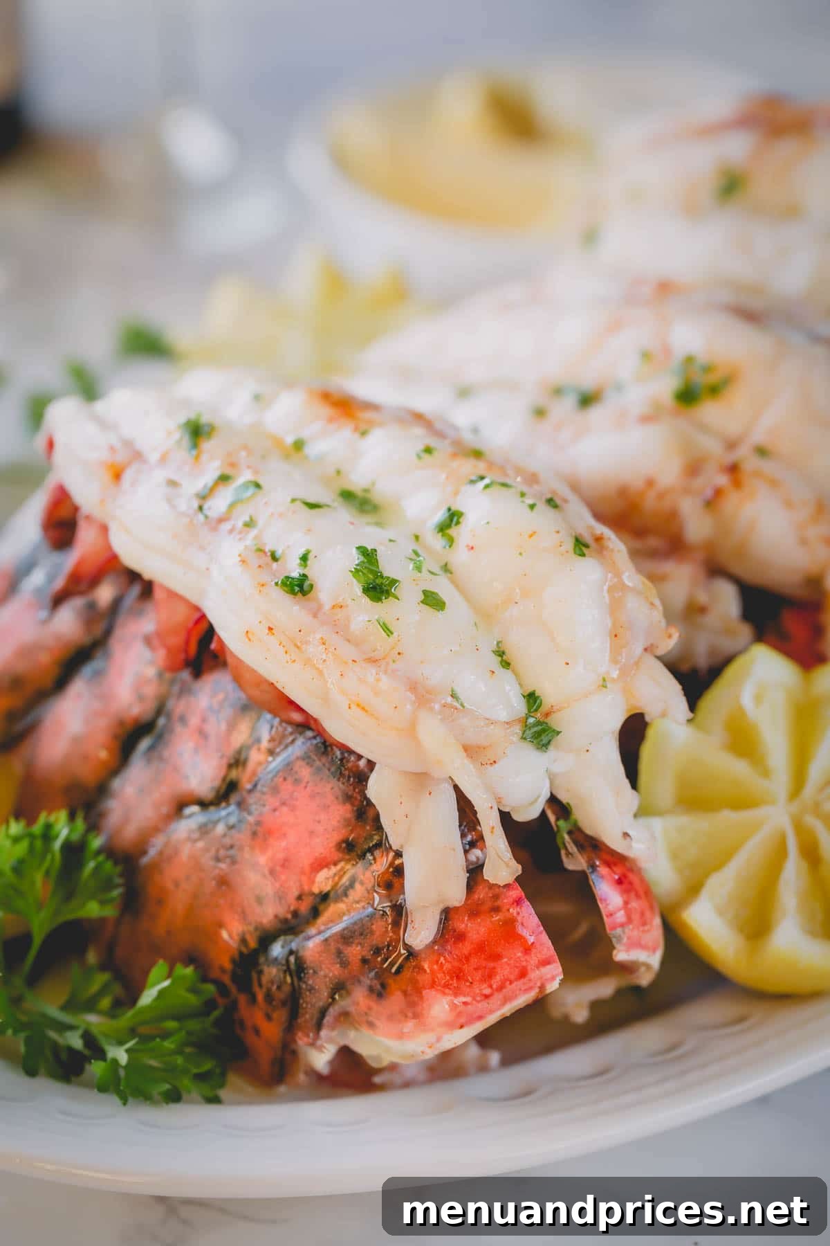 Perfectly Baked Lobster Tails 6 A single baked lobster tail, artfully presented on its shell with garnishes, ready to be enjoyed.