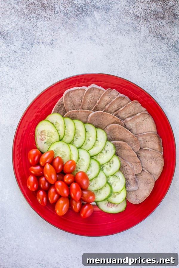 Savory Mongolian Tongue Bites 4 Thinly sliced beef tongue is a popular Mongolian appetizer, often served with cucumbers and tomatoes.