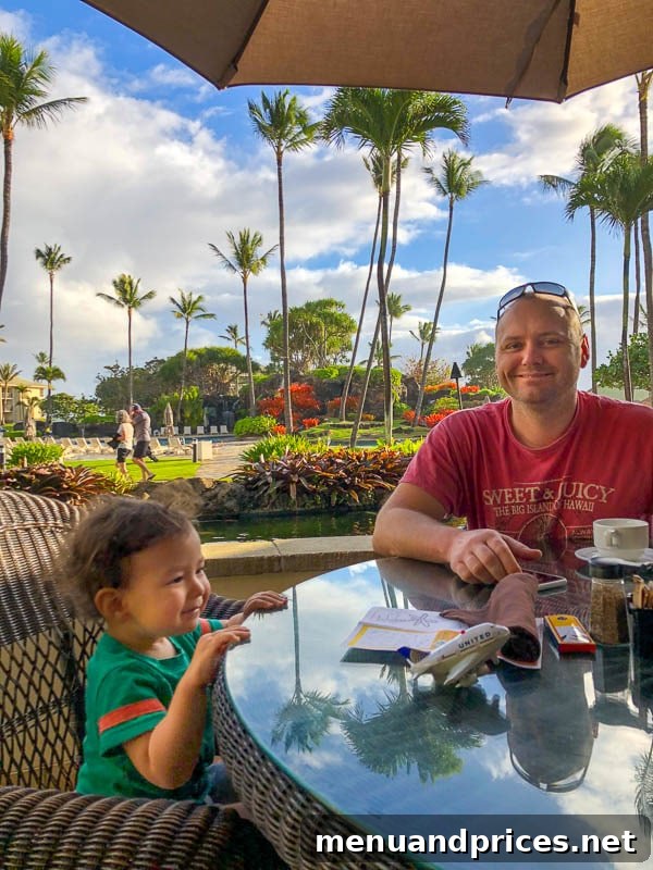 Kauai Through Toddler Eyes 60 Toddler waiting for breakfast