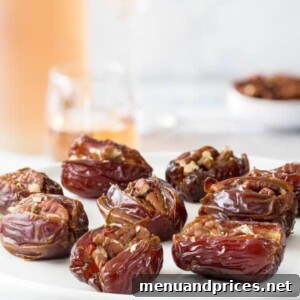 Roasted stuffed dates with cream cheese on a plate.