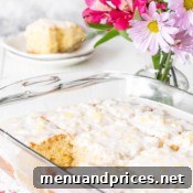 A baking dish of pineapple cake with a square missing.