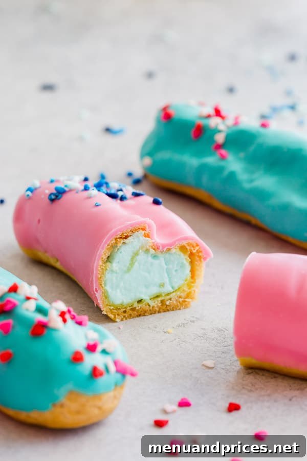 A close-up of a gender reveal eclair, sliced open to reveal a vibrant blue cream filling, announcing 'It's a BOY!' #BabyBoy #GenderRevealDessert #BlueEclairs