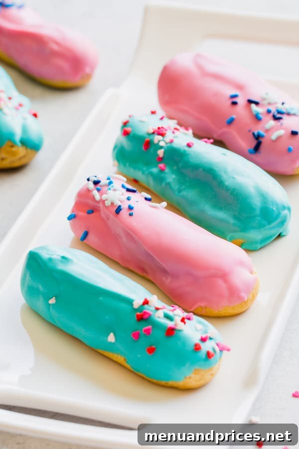 A stack of gender reveal eclairs, half pink and half blue, symbolizing the exciting anticipation of a baby's gender. #GenderRevealFood #SweetTreats #Celebration