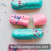 A charming image of a gender reveal eclair, representing the joy of announcing a baby's gender with a sweet treat.