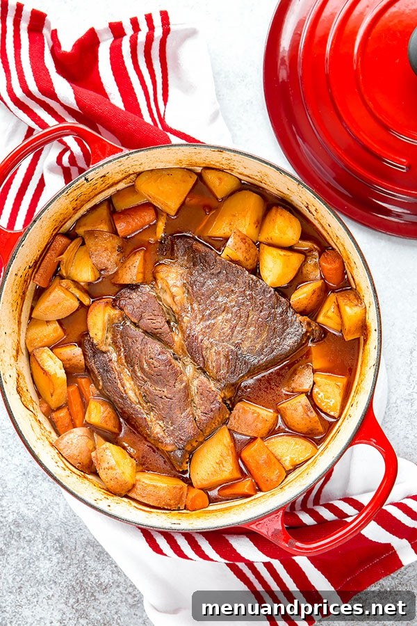 No-Fuss Pot Roast 2 A beautifully seared chuck roast in a Dutch oven, ready for slow cooking. This image highlights the rich browning achieved before adding other ingredients, crucial for flavor development in this melt-in-your-mouth pot roast recipe.