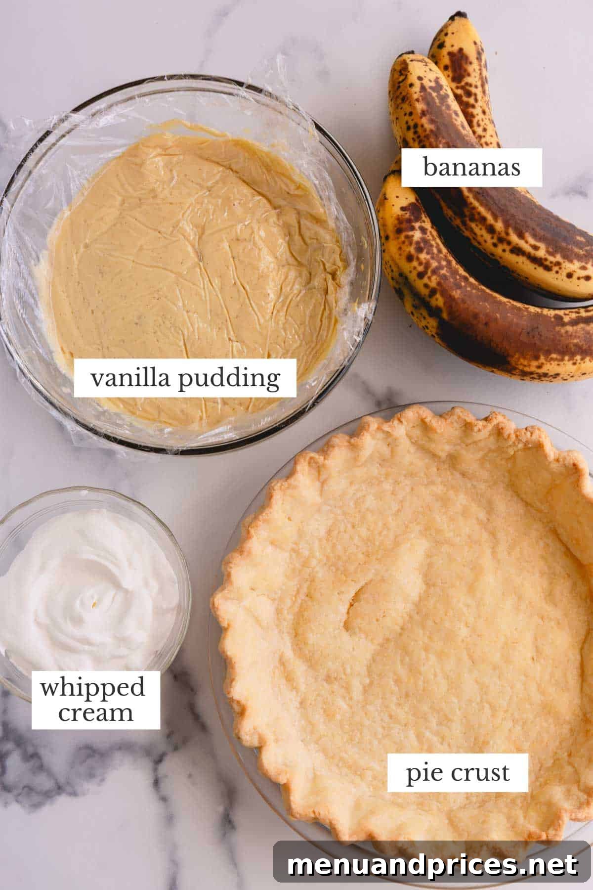 Luscious Banana Dream Pie 4 Four components of banana cream pie laid out: a blind-baked pie crust, a bowl of vanilla pudding, sliced fresh bananas, and fluffy whipped cream.