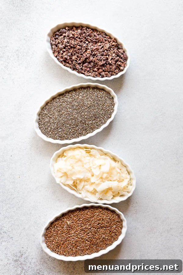 Crafting Your Dream Yogurt Bar 4 A vibrant selection of healthy toppings for fun yogurt bowls, including cocoa nibs, chia seeds, coconut chips, and flax seeds, perfect for an ultimate yogurt bar. #yogurtbar #snack #healthysnack #snacktime #yogurtbowl