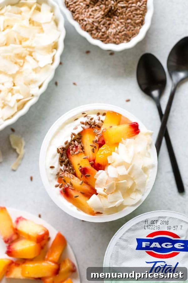 Crafting Your Dream Yogurt Bar 6 A trendy yogurt bowl featuring toasted coconut chips, frozen peaches, ground flax seeds, and a drizzle of honey, perfect for a modern and healthy snack. #yogurtbar #snack #healthysnack #snacktime #yogurtbowl