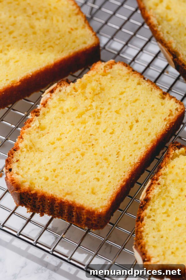 Yogurt-Kissed Almond Cake 3 Ingredients for almond cake: eggs, all purpose flour, almond flour, Greek yogurt, vegetable oil, sugar and lemon zest laid out on a kitchen counter.