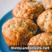 Another image of banana muffins on a blue plate, inviting viewers to try the recipe.