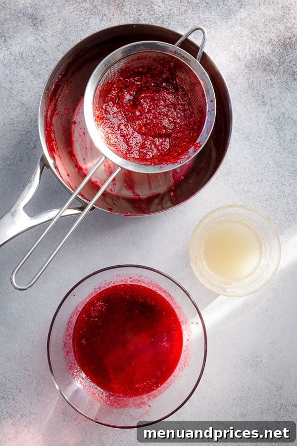 Homemade raspberry jello with visible real berries, fresh and vibrant.