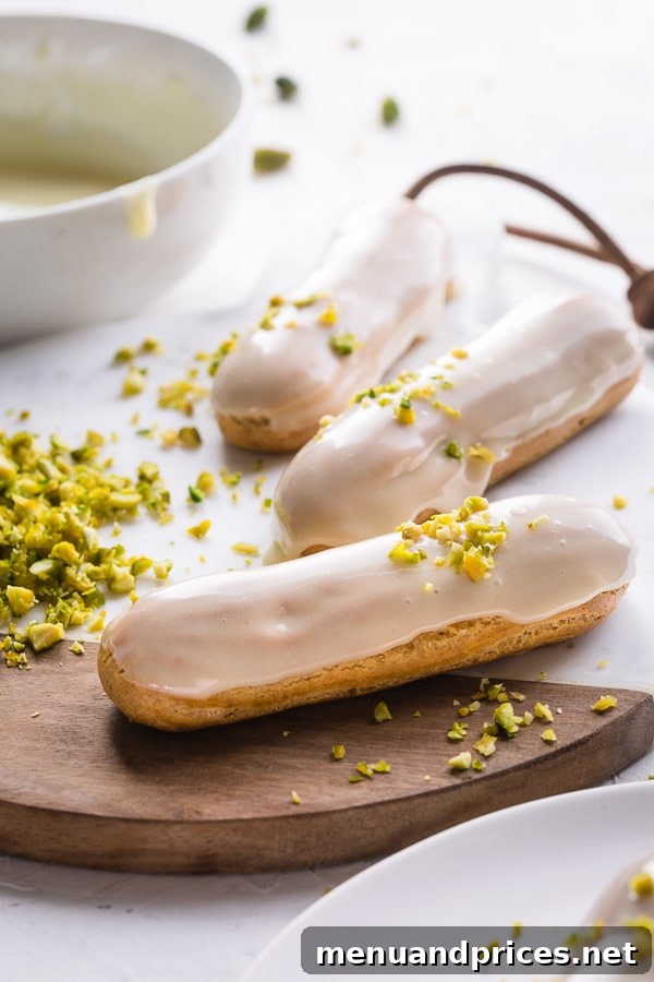 Decadent Pistachio Eclairs 2 Beautifully arranged pistachio eclairs on a serving platter, showcasing their vibrant green filling.