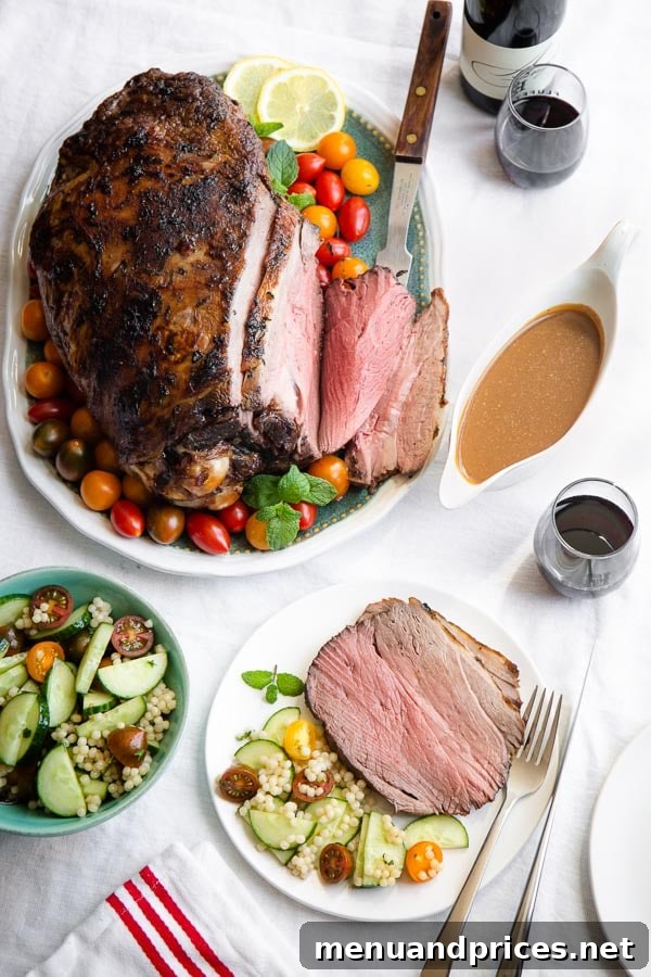 Slow-Roasted Lamb Leg with Robust Red Wine Reduction 2 Roasted leg of lamb with a vibrant couscous salad, ready to be served.