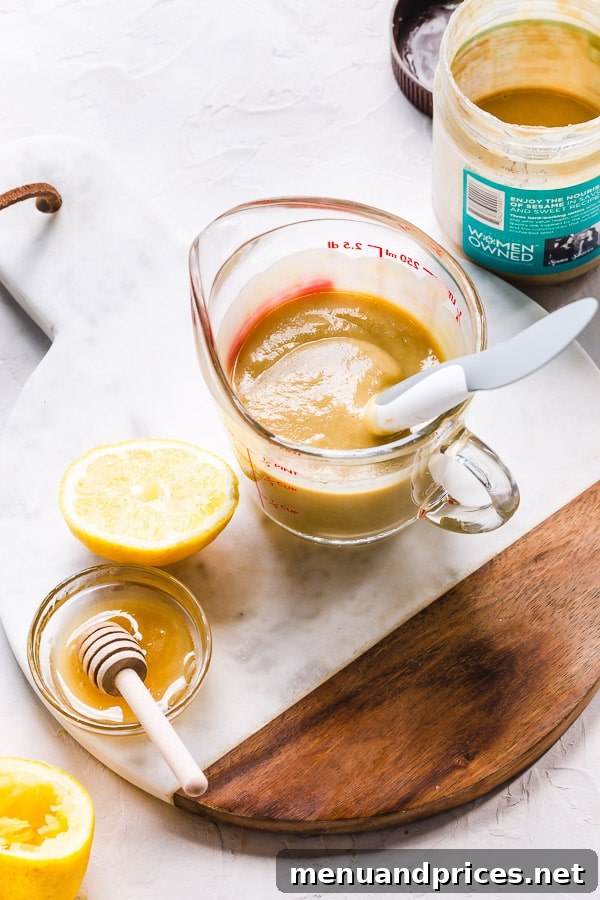 Tahini's Secret Weapon 3 Close-up shot of creamy tahini dressing in a bowl, showcasing its smooth texture.
