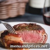 Sliced bacon wrapped filet mignon.