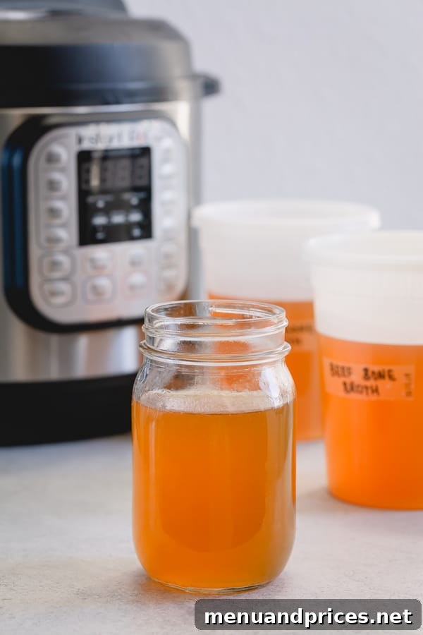Homemade Beef Bone Broth: Simmering Wellness in Every Sip 3 Containers of homemade beef bone broth, ready for freezer storage to preserve freshness and nutrients.