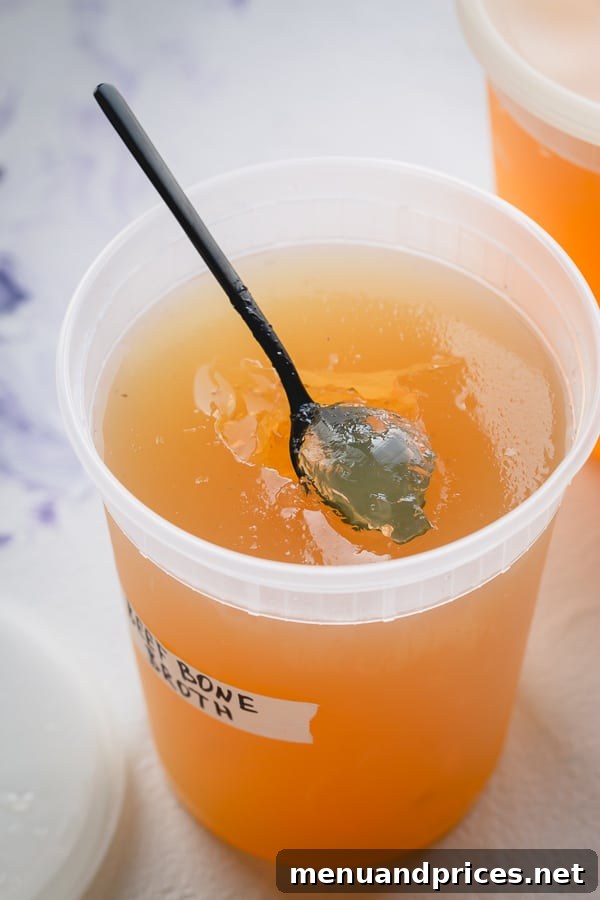 Homemade Beef Bone Broth: Simmering Wellness in Every Sip 7 Variety of containers filled with frozen beef bone broth, showcasing convenient storage solutions.