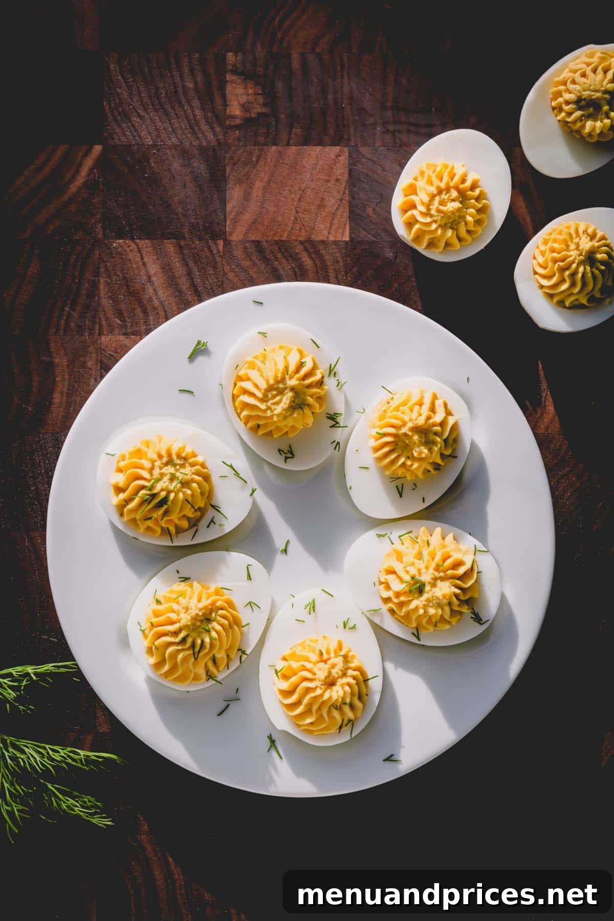Simple Steps to Irresistible Deviled Eggs 8 A serving platter adorned with beautifully arranged classic deviled eggs, garnished with fresh dill, presented elegantly for a special occasion.